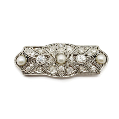 Edwardian platinum brooch set with old cut diamonds and three pearls, floral filigree design