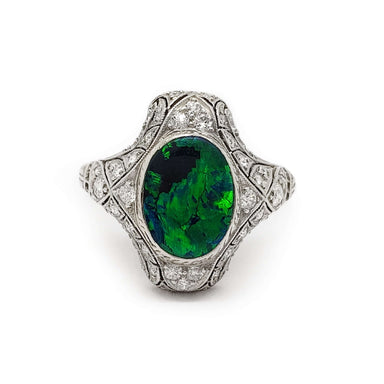 Edwardian platinum ring with oval black and green opal and pavé-set diamonds, front view