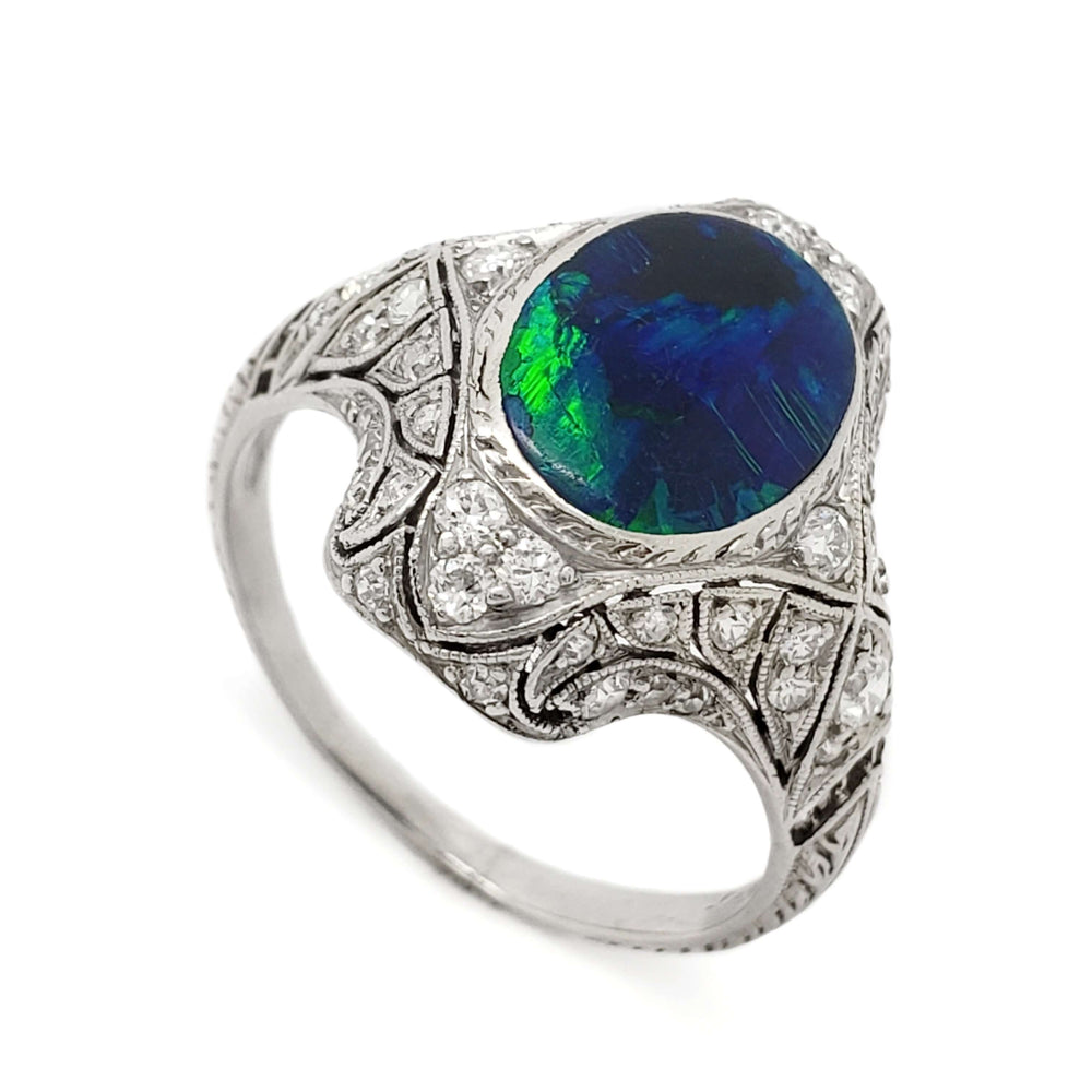 Edwardian platinum ring with oval opal and diamonds, angled top view