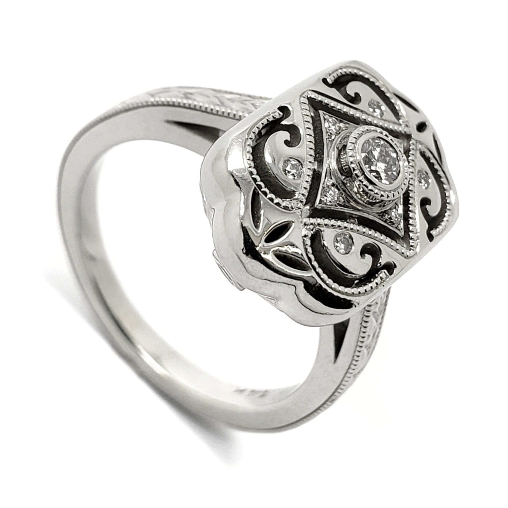 Edwardian style 14kt white gold engagement ring with hand engraved details and diamonds
