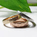 Three elephant skin texture wedding bands in white, yellow, and rose gold