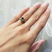 Ella 14kt yellow gold green sapphire ring worn on hand, showing elegant fit