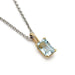 Emerald cut aquamarine pendant in 10kt yellow gold on a silver chain, close-up view