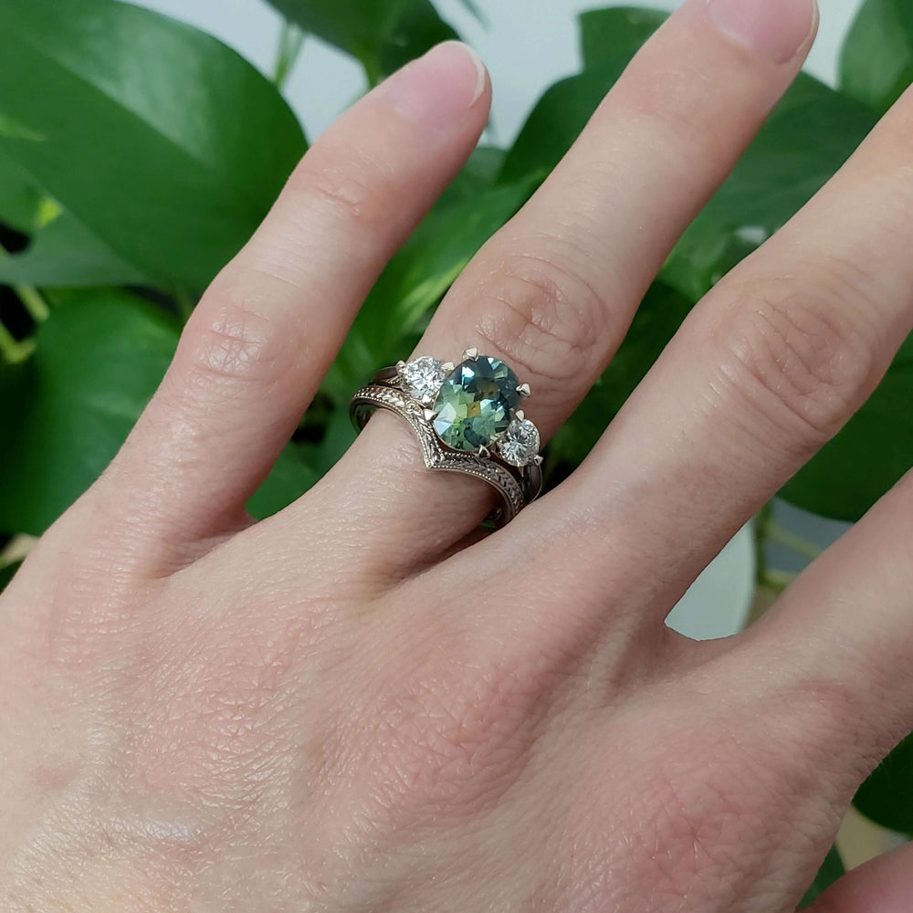 Engraved 14kt white gold chevron wedding ring stacked with gemstone and diamond ring on hand