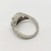 Detailed engraving on the band of a white gold Montana sapphire and diamond ring
