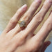 Eowyn engagement ring on hand, featuring marquise-oval lab diamond in yellow gold