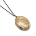 A gold oval locket necklace with intricate floral engravings, suspended from a thin black chain against a plain white background.