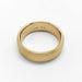 Flat 14k yellow gold wedding ring with brushed texture, viewed from above