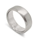 Flat 14kt white gold wedding band with brushed finish, angled view