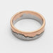 Flat profile 14k white and rose gold mountain range wedding ring on white background