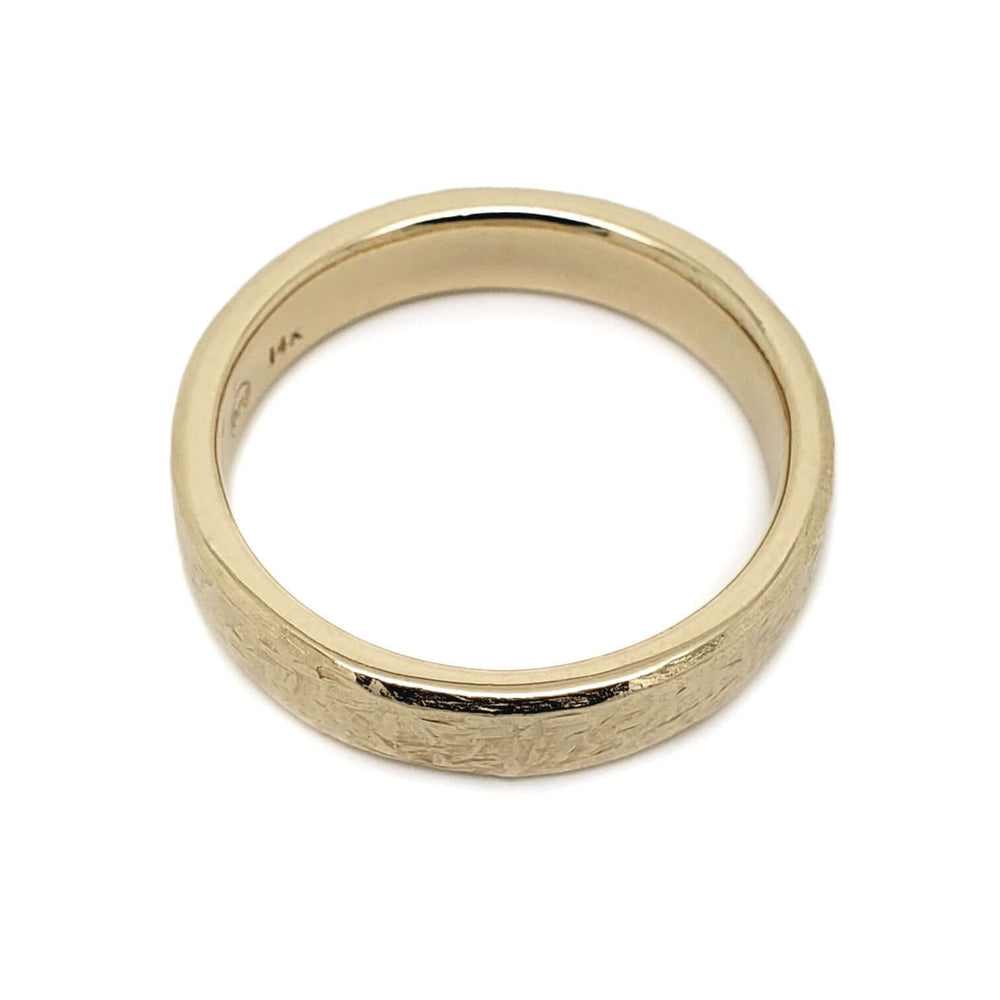 Flat profile 14kt yellow gold wedding ring with elephant skin texture, top view