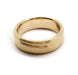 Flat profile 14kt yellow gold wedding ring with brushed finish and carved accent