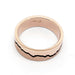 Flat profile rose gold wedding band with blackened mountain silhouette and textured finish