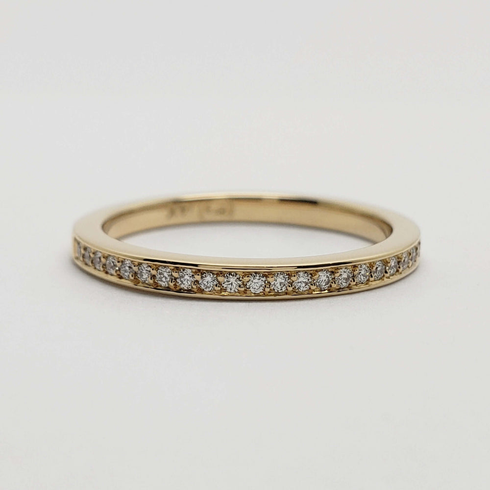 Flat profile 14kt yellow gold wedding ring with pave-set Canadian diamonds