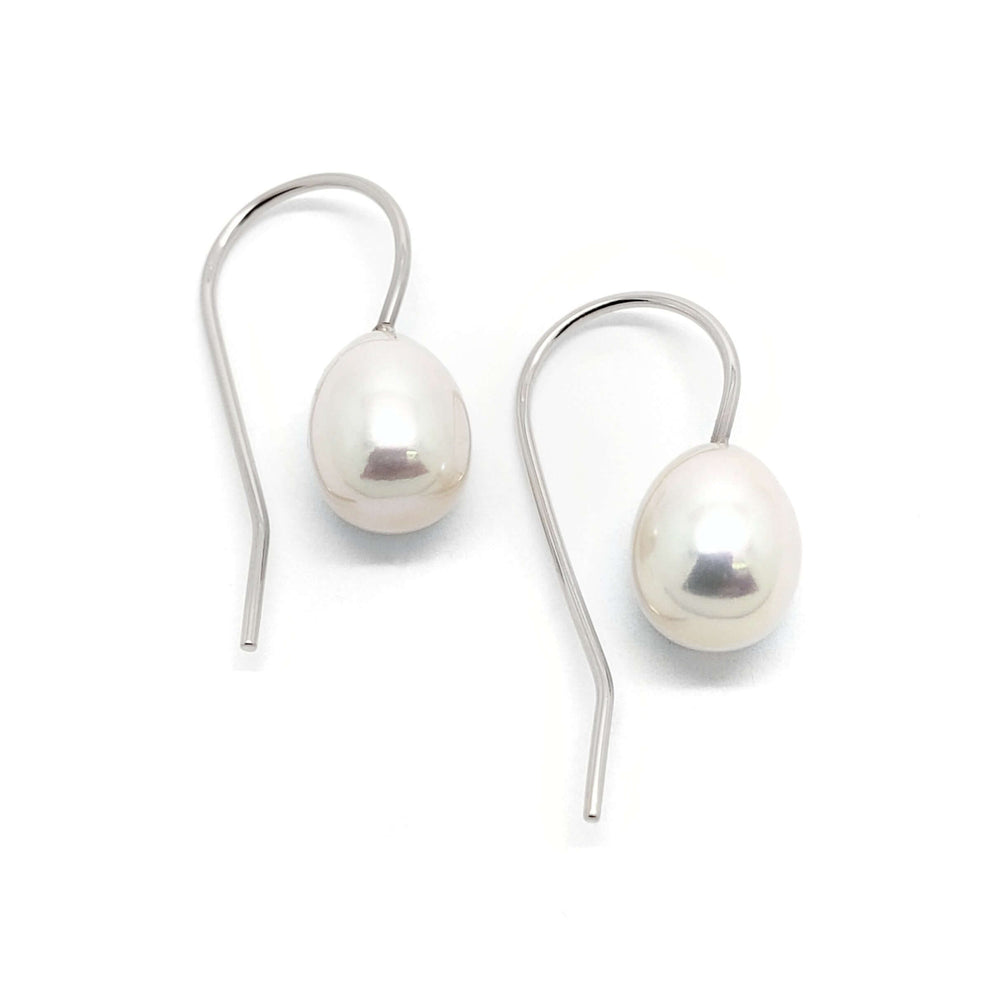 Pair of freshwater pearl drop earrings with white 14kt gold hooks on white background