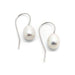 Pair of freshwater pearl drop earrings with white 14kt gold hooks on white background