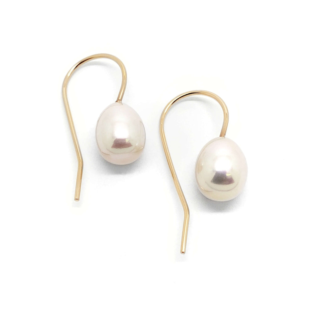 Pair of freshwater pearl drop earrings with yellow 14kt gold hooks on white background
