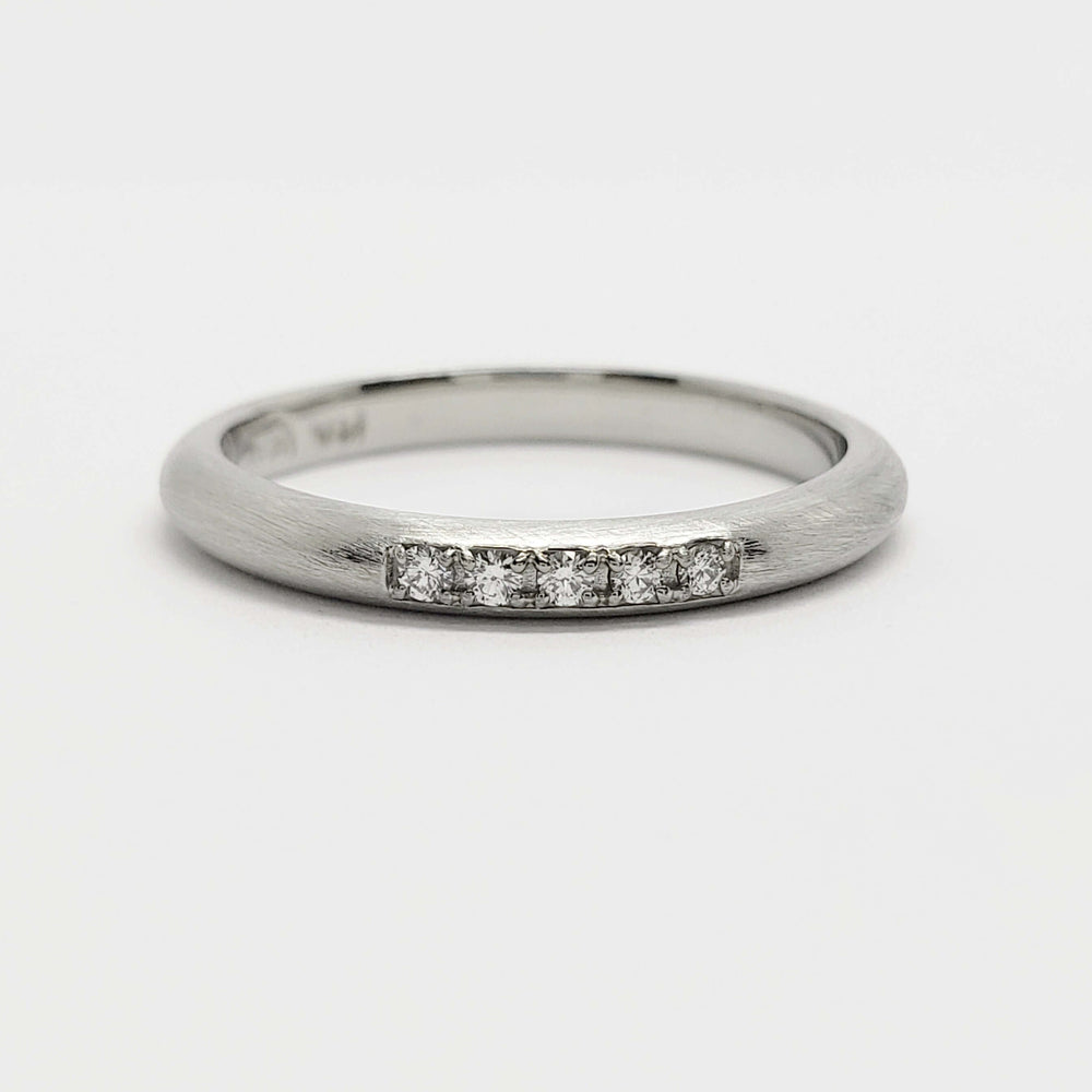 Front view of 14kt white gold wedding ring with five Canadian diamonds