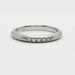 Front view of 14kt white gold wedding ring with five Canadian diamonds