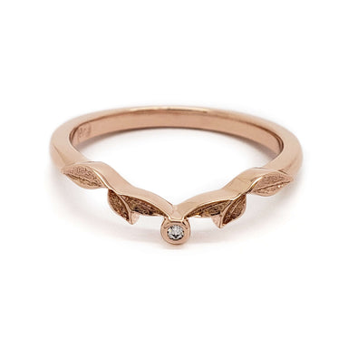 Front view of 14k rose gold leafy wedding band with bezel-set Canadian diamond