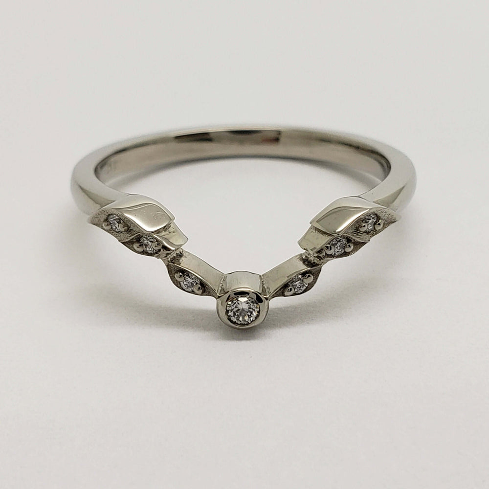 Front view of 14k white gold leafy wedding band with bezel and pave-set lab diamonds