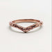 Front view of 14kt rose gold chevron wedding ring with detailed engraving