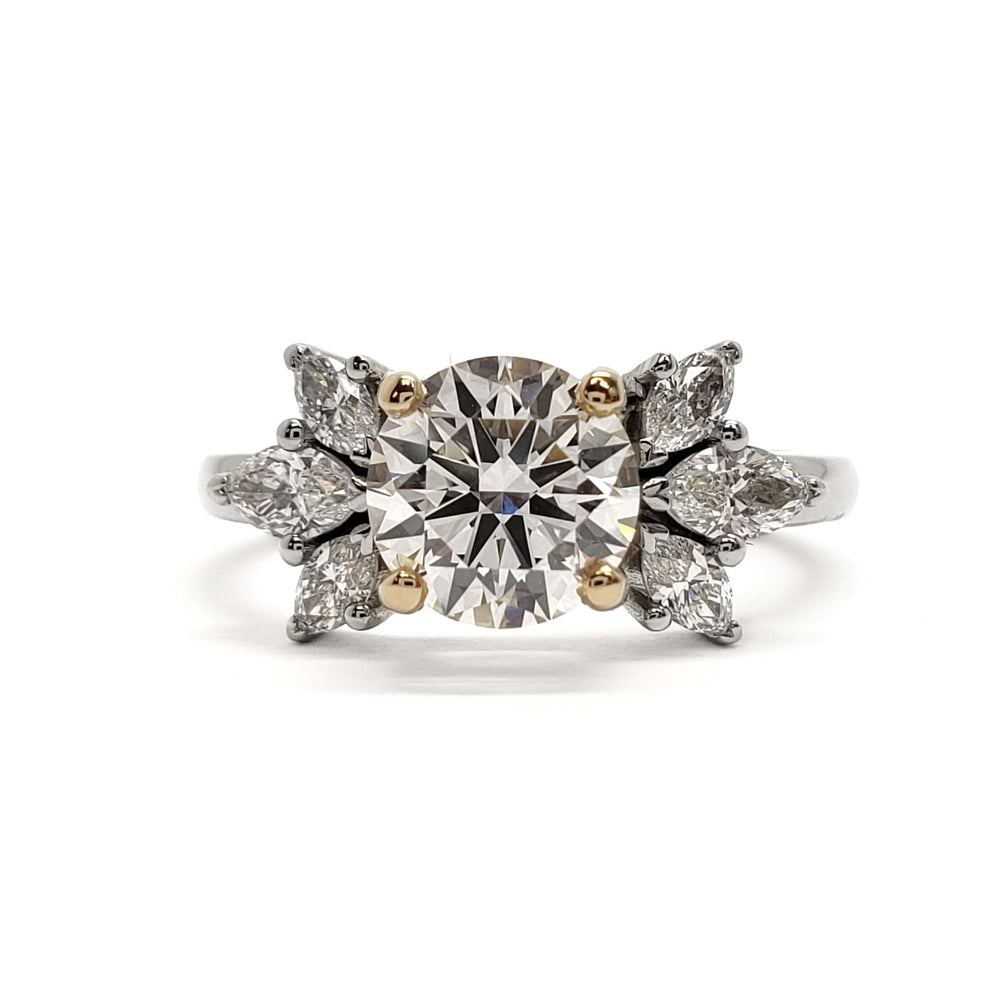 Front view of 14kt white and yellow gold engagement ring with round lab diamond and marquise accents