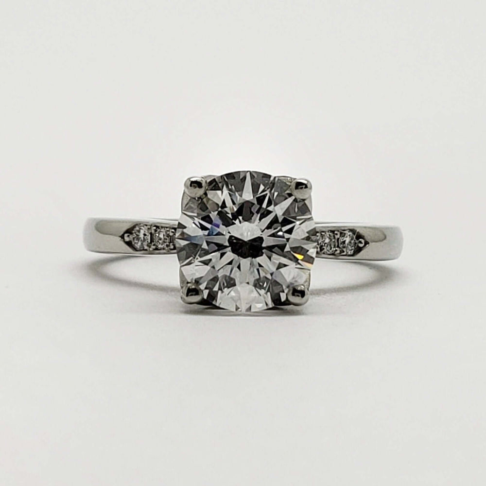Front view of 14kt white gold engagement ring with round lab diamond and side diamonds