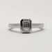 Front view of 14kt white gold ring with emerald cut lab diamond bezel set