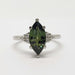 Front view of 14kt white gold ring with marquise green sapphire and diamond clusters