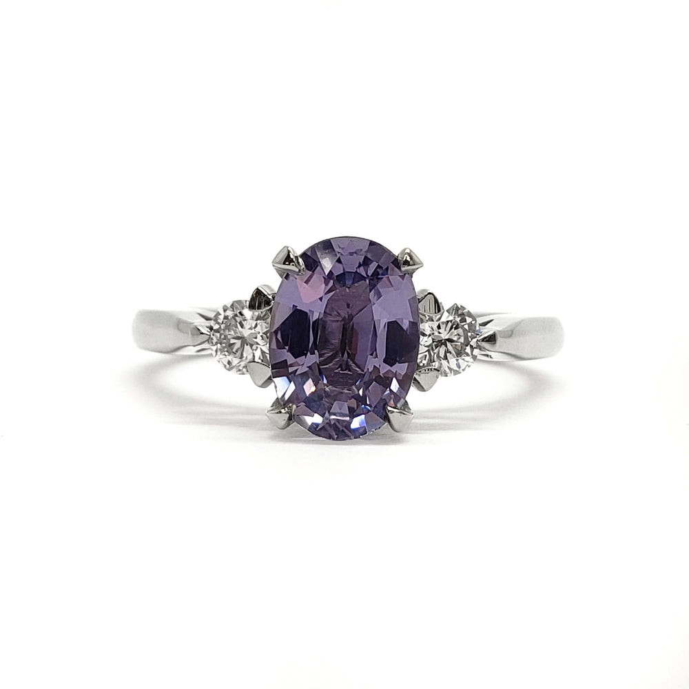 Front view of 14kt white gold ring with oval lavender sapphire and lab diamonds