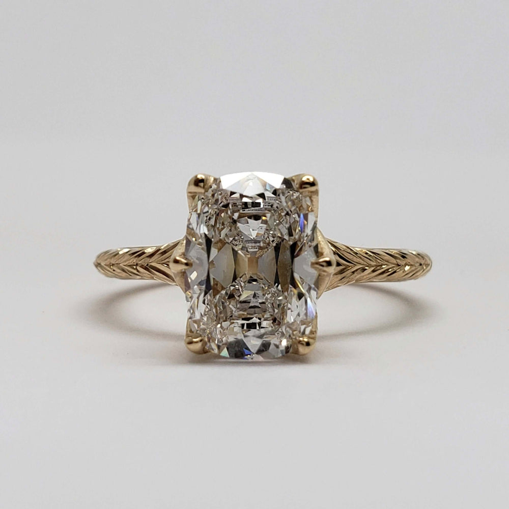 Front view of 14kt yellow gold engagement ring with cushion cut lab diamond