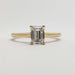 Front view of emerald cut lab diamond solitaire ring in 14kt yellow gold