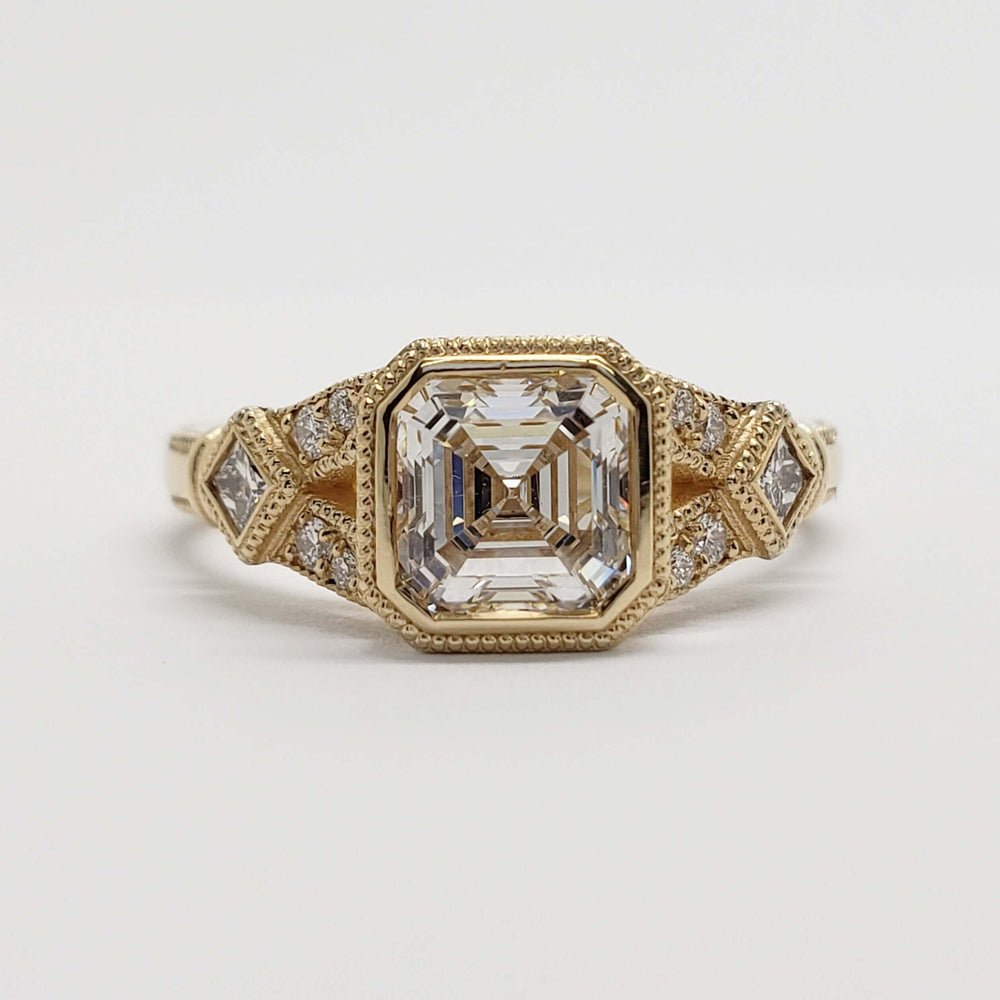 Front view of 14kt yellow gold engagement ring with asscher cut lab diamond and accent stones