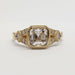 Front view of 14kt yellow gold engagement ring with asscher cut lab diamond and accent stones