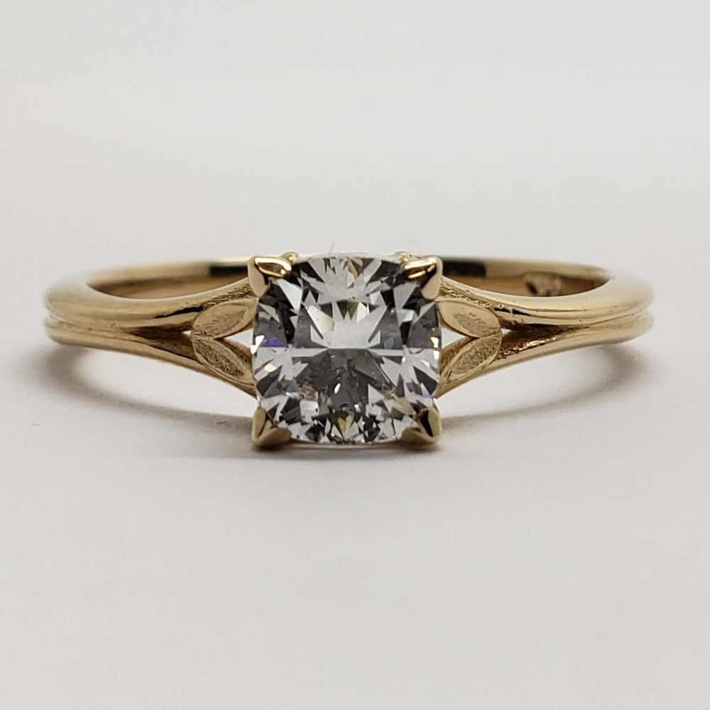 Front view of 14kt yellow gold engagement ring with cushion lab diamond