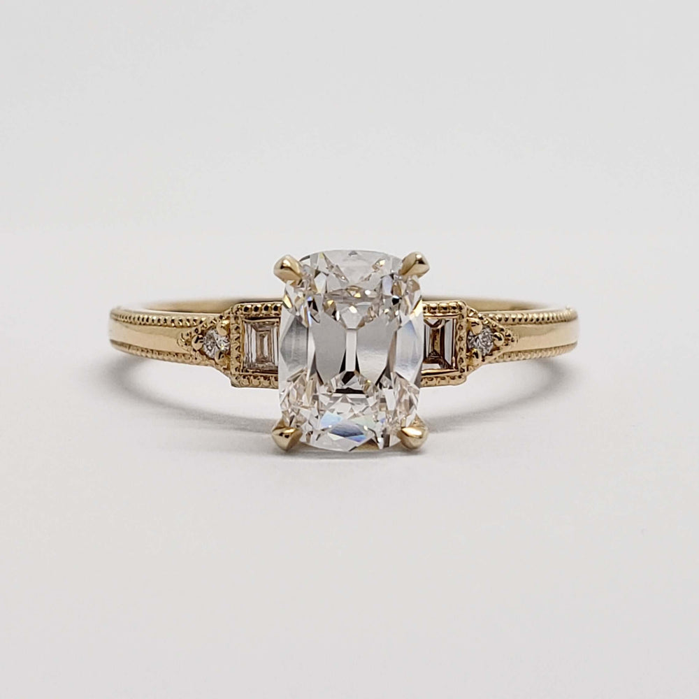 Front view of 14kt yellow gold engagement ring with lab diamond and baguette accents