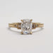 Front view of 14kt yellow gold engagement ring with lab diamond and baguette accents