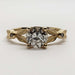 Front view of 14kt yellow gold engagement ring with old European cut lab diamond and leaf details