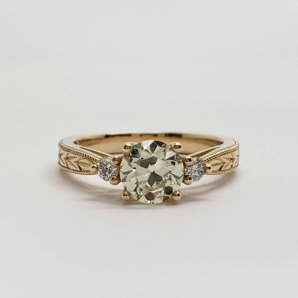 Front view of 14kt yellow gold engagement ring with old European diamond and side diamonds