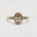 Front view of 14kt yellow gold oval lab diamond engagement ring with millgrain edges