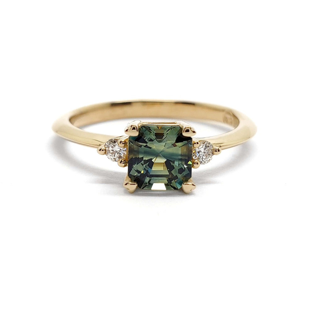 Front view of 14kt yellow gold ring with asscher cut parti sapphire and lab diamonds