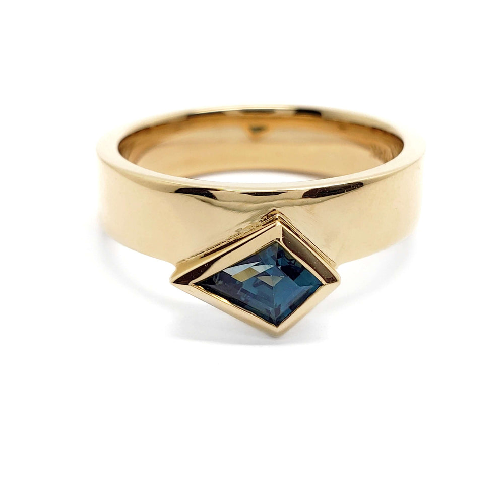 Front view of 14kt yellow gold ring with bezel-set kite-shaped blue-green sapphire