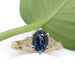 Front view of 14kt yellow gold ring with blue Montana sapphire and diamond accents