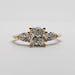Front view of 14kt yellow gold ring with cushion cut lab diamond and pear side stones