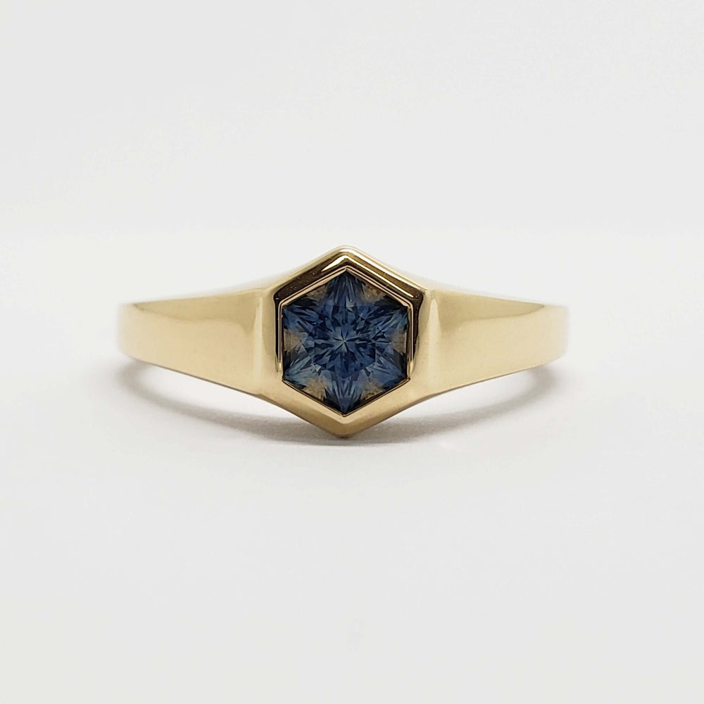 Front view of 14kt yellow gold ring with hexagon teal Montana sapphire