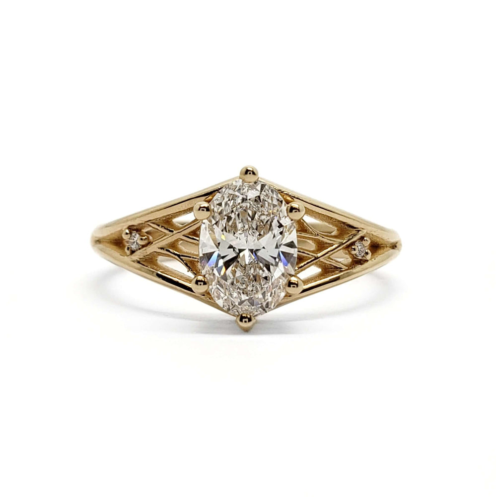 Front view of 14kt yellow gold ring with oval lab diamond and openwork sides