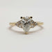 Front view of 14kt yellow gold ring with pear lab diamond and accent diamonds