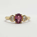Front view of 14kt yellow gold ring with pink sapphire and heart-shaped lab diamonds