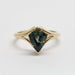 Front view of 14kt yellow gold ring with shield cut teal sapphire in split-shank setting